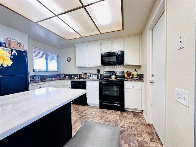 kitchen with white cabinetry and black appliances