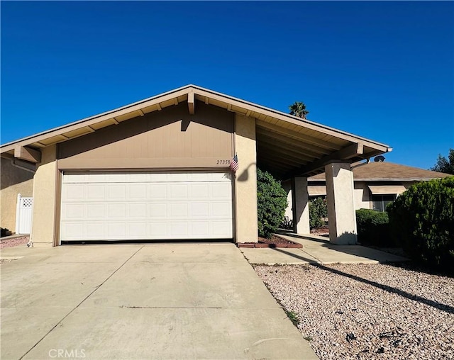27358 Comwell St, Menifee, CA 92586 - view of front of property featuring an attached garage, stucco siding, and concrete driveway