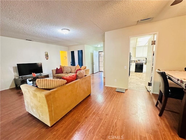 27358 Comwell St, Menifee, CA 92586 - living area with a textured ceiling and wood finished floors