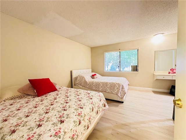 27358 Comwell St, Menifee, CA 92586 - bedroom with baseboards, a textured ceiling, and wood finished floors