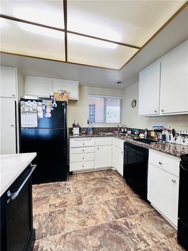 27358 Comwell St, Menifee, CA 92586 - kitchen featuring stone finish flooring, white cabinets, dark stone countertops, and black appliances