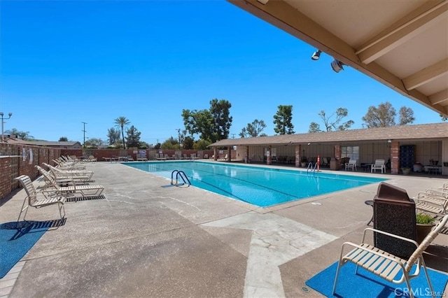 view of swimming pool featuring a patio