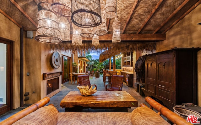 interior space featuring vaulted ceiling with beams