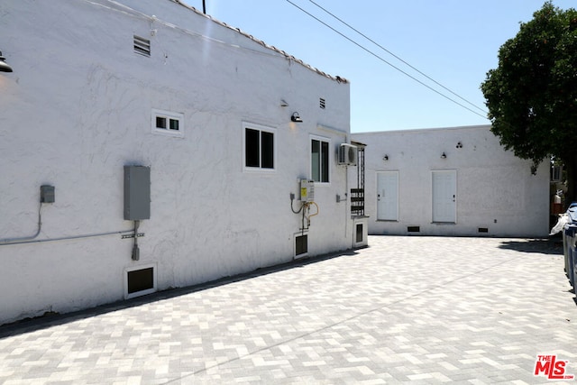 exterior space with an AC wall unit