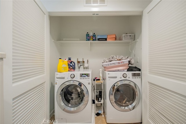 laundry area featuring washing machine and dryer