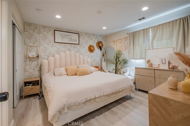 bedroom with light hardwood / wood-style flooring