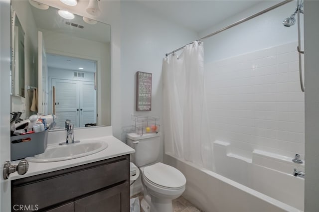 full bathroom with toilet, vanity, and shower / tub combo