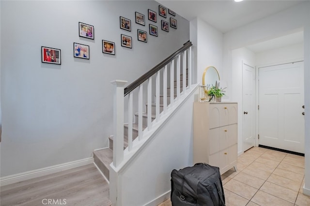 staircase featuring hardwood / wood-style floors