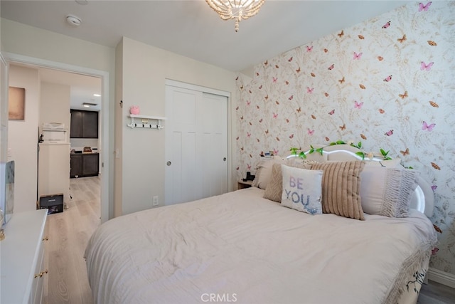 bedroom with light wood-type flooring