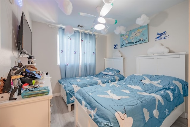 bedroom featuring ceiling fan and light hardwood / wood-style floors