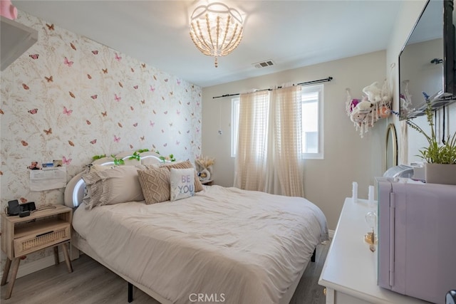 bedroom with hardwood / wood-style floors