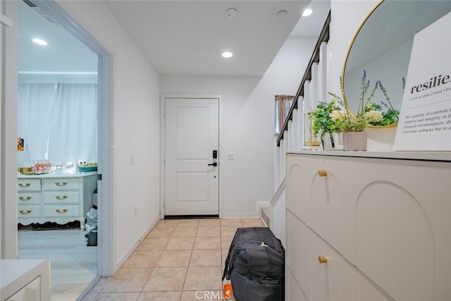 entryway featuring light tile patterned flooring