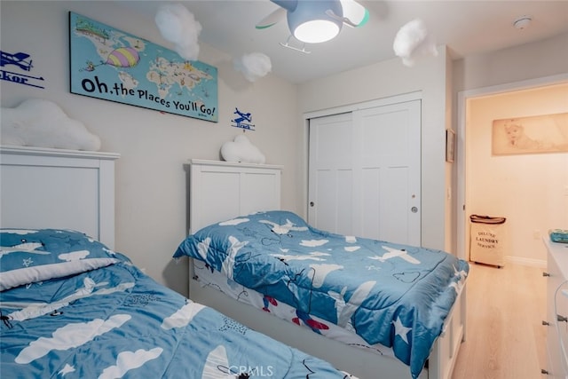 bedroom featuring a closet, ceiling fan, and hardwood / wood-style floors