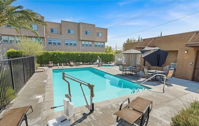 view of swimming pool featuring a patio area