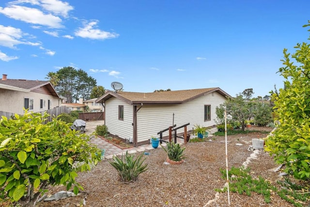 view of side of property featuring a patio