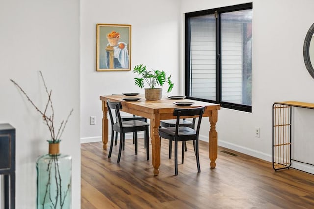 dining space featuring hardwood / wood-style floors