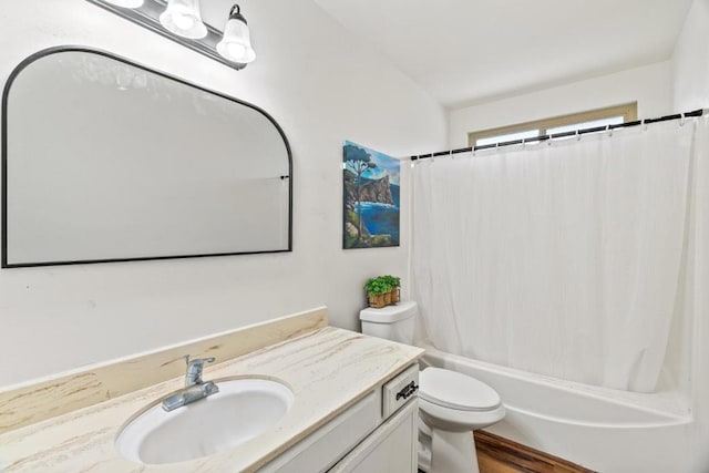 full bathroom with hardwood / wood-style floors, vanity, toilet, and shower / tub combo