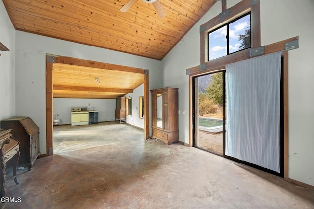 interior space with vaulted ceiling with beams, wood ceiling, ceiling fan, and concrete flooring