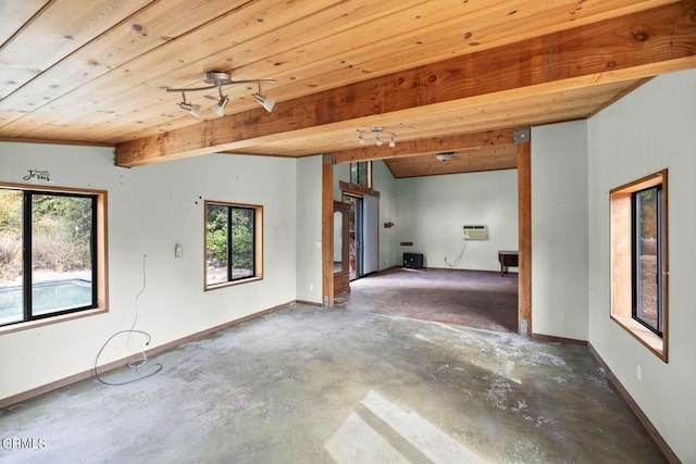 spare room with lofted ceiling with beams, plenty of natural light, and wooden ceiling