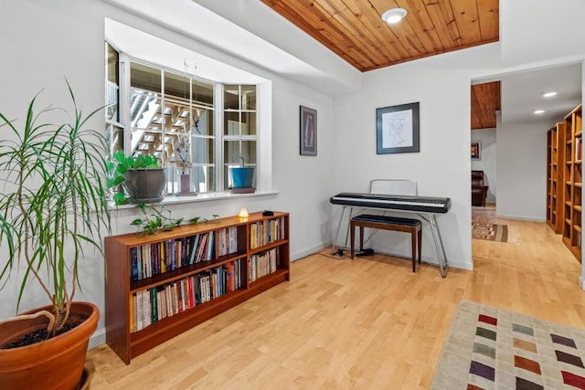 miscellaneous room with light wood-type flooring and wood ceiling