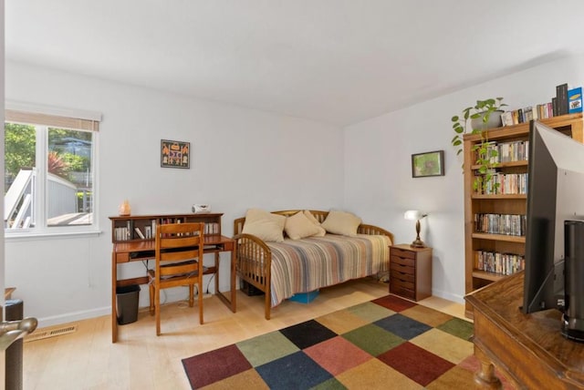 bedroom with wood-type flooring