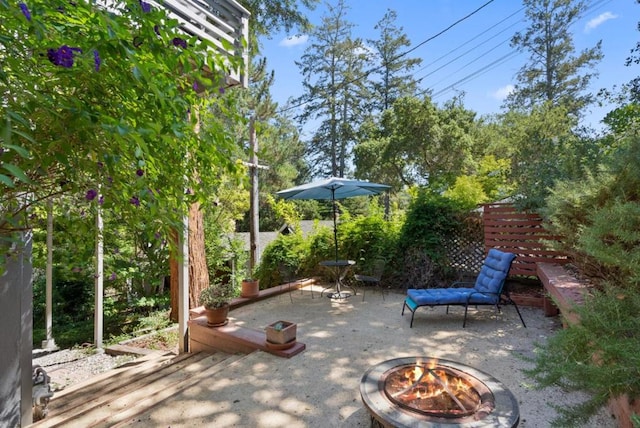 view of patio / terrace with an outdoor fire pit