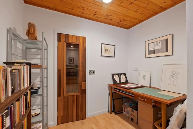 office featuring light wood-type flooring and wood ceiling