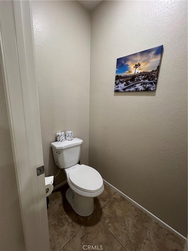 41097 Maiden Ct, Indio, CA 92203 - bathroom with toilet, tile patterned flooring, and baseboards