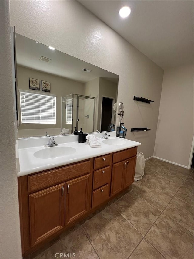 41097 Maiden Ct, Indio, CA 92203 - bathroom featuring double vanity, a stall shower, tile patterned floors, and recessed lighting