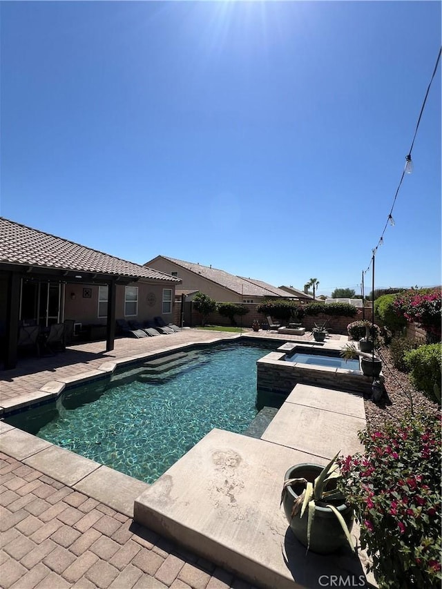 41097 Maiden Ct, Indio, CA 92203 - view of swimming pool featuring an in-ground hot tub, a patio, and a fenced backyard
