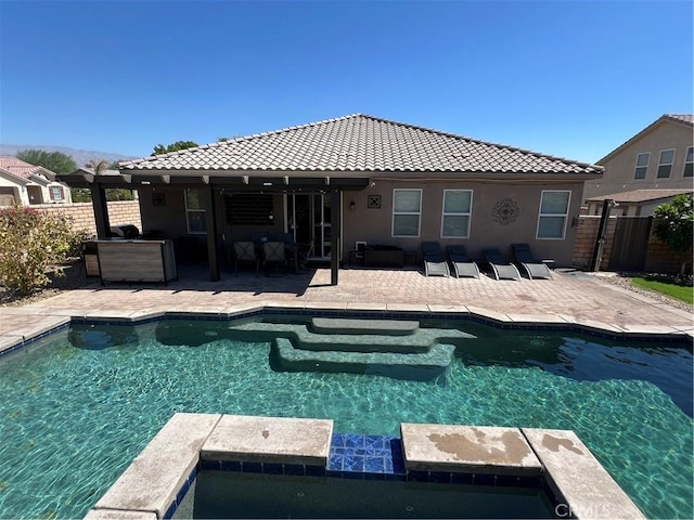 41097 Maiden Ct, Indio, CA 92203 - view of pool with a patio, a pool with connected hot tub, and an outdoor living space