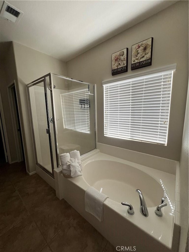 41097 Maiden Ct, Indio, CA 92203 - bathroom featuring a bath, a shower stall, and tile patterned floors