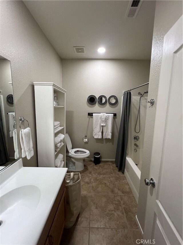 41097 Maiden Ct, Indio, CA 92203 - full bathroom featuring vanity, toilet, and shower / bath combo with shower curtain