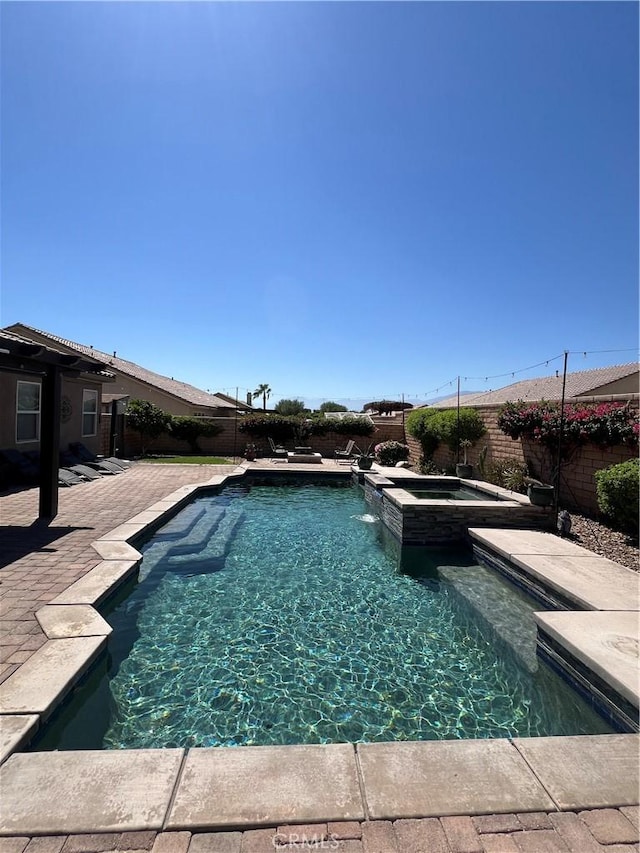 41097 Maiden Ct, Indio, CA 92203 - view of swimming pool with a fenced backyard, a pool with connected hot tub, and a patio