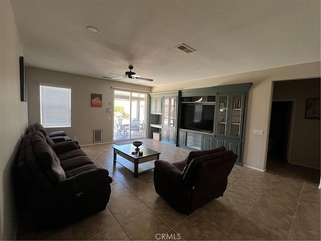 41097 Maiden Ct, Indio, CA 92203 - tiled living area with ceiling fan, baseboards, and a textured ceiling