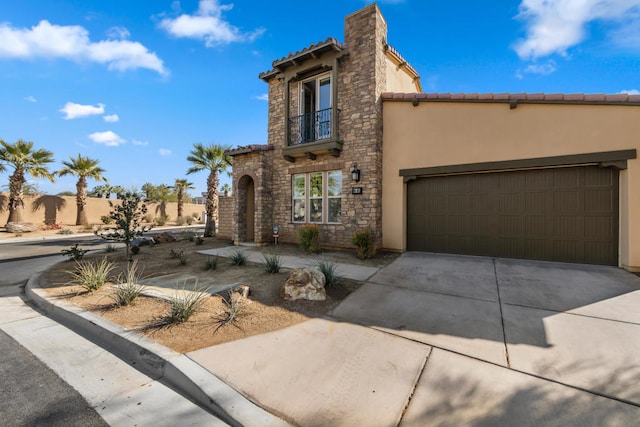 mediterranean / spanish-style home featuring a garage