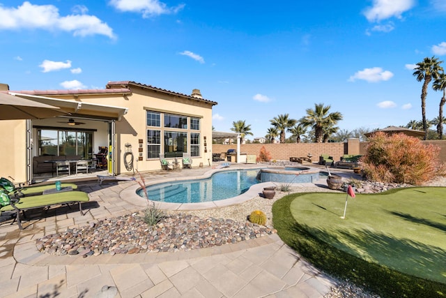 view of pool featuring a patio and ceiling fan