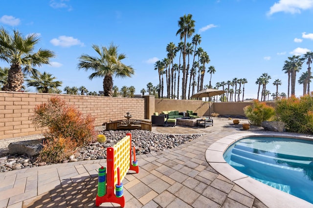 view of patio / terrace featuring an outdoor hangout area and a fenced in pool