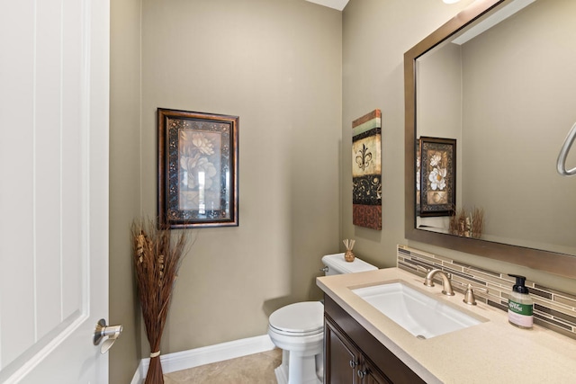 bathroom featuring vanity, backsplash, toilet, and tile patterned flooring