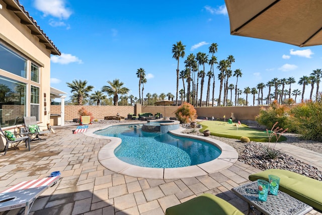 view of swimming pool with an in ground hot tub and a patio