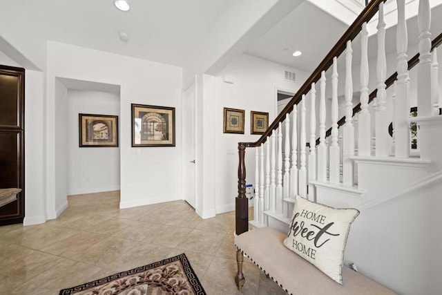 entryway with light tile patterned floors