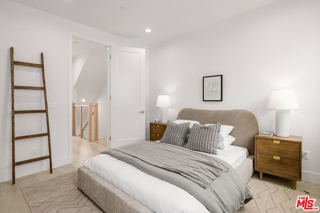 bedroom with light wood-type flooring