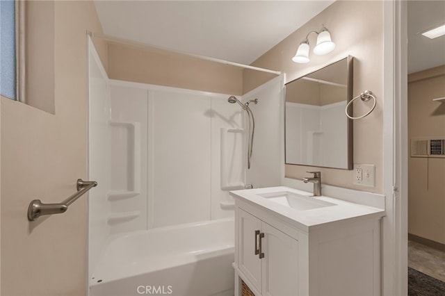 bathroom featuring shower / tub combination and vanity