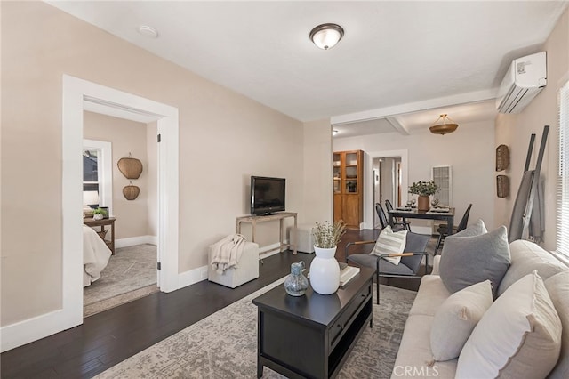 living room with dark wood-type flooring and a wall mounted AC