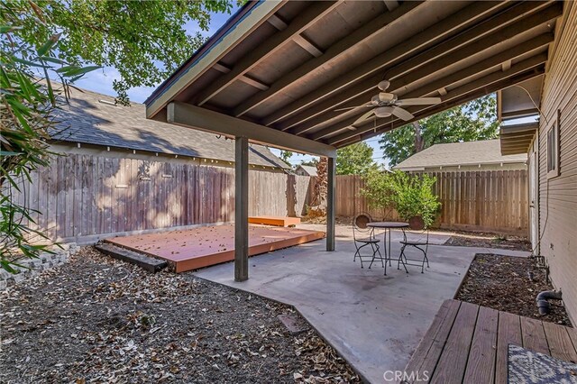 exterior space featuring ceiling fan and a deck