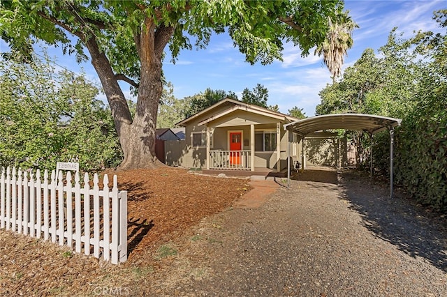 view of front of house featuring a carport and a porch