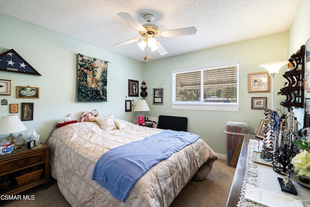 carpeted bedroom with ceiling fan and a textured ceiling