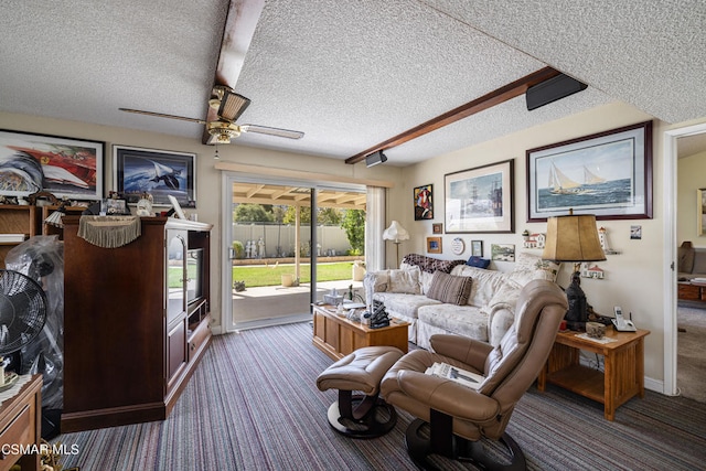 carpeted living room featuring a textured ceiling and ceiling fan