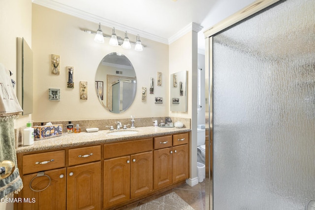 bathroom featuring walk in shower, crown molding, vanity, and toilet