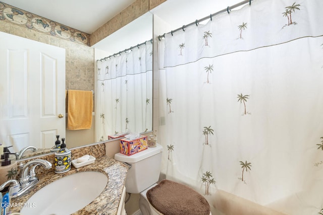 full bathroom featuring shower / bath combination with curtain, vanity, and toilet